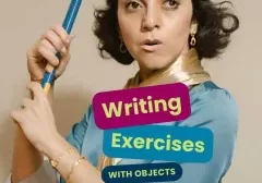 Writer holds large pen for writing exercise